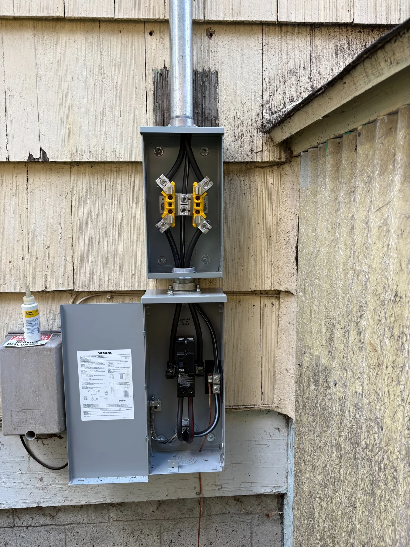 Open residential electrical service upgrade with organized wiring